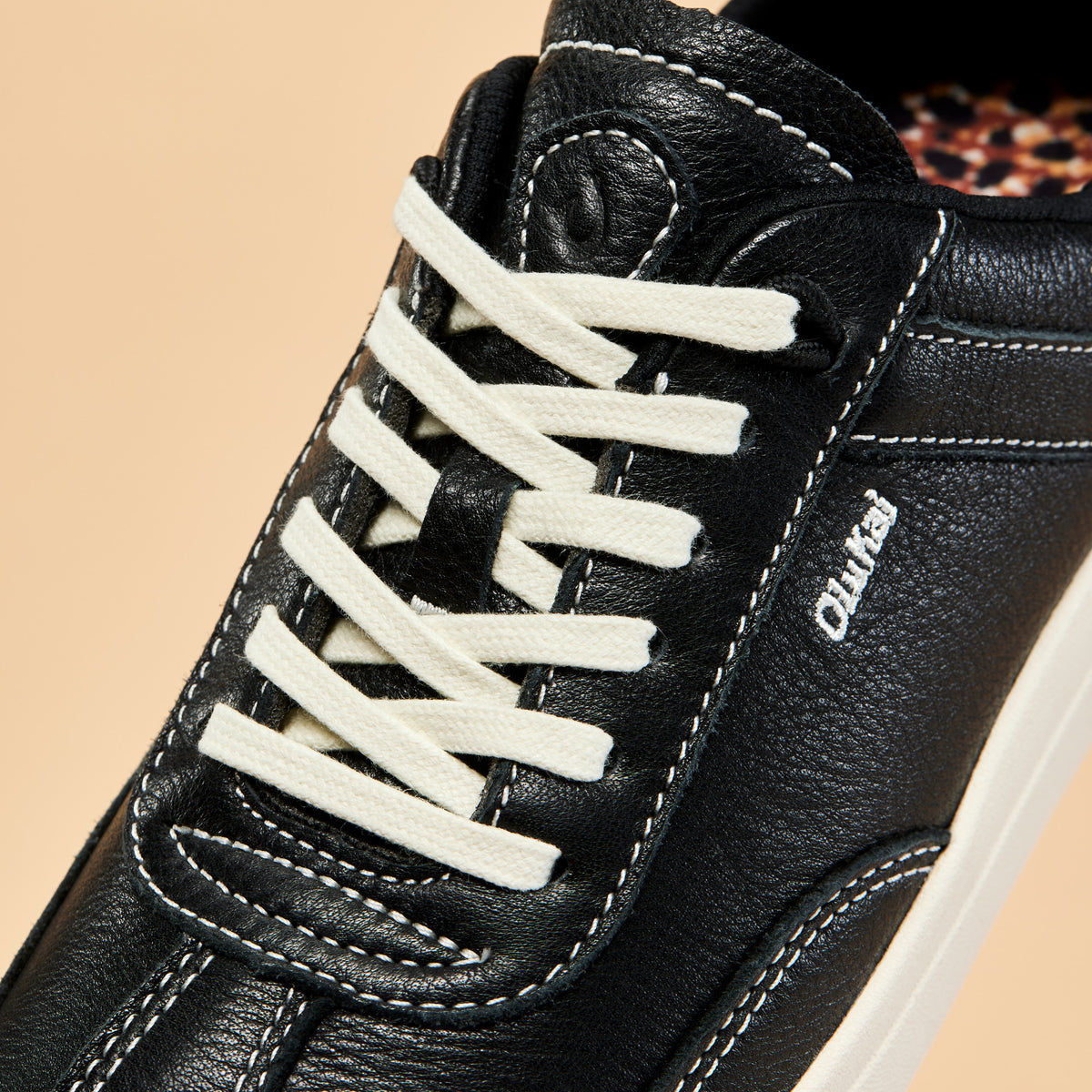 OluKai Smart Buy | Hā‘upu Women’s Leather Sneakers - Onyx